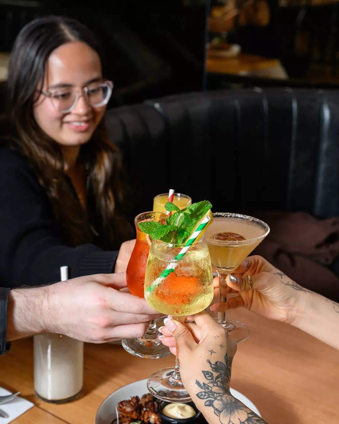 Friends raising cocktails